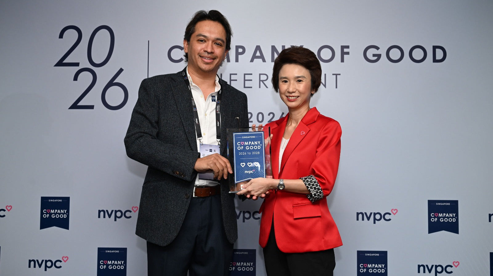 Dr Samintharaj Kumar accepts the Singapore Company of Good 3 Hearts Recognition on behalf of Nuffield Holdings Private Limited