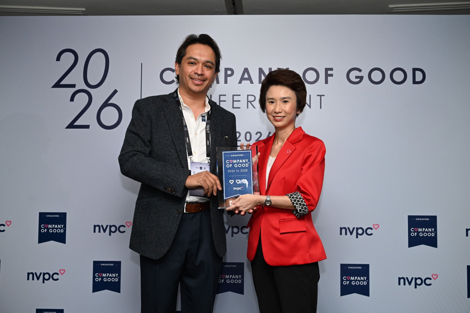Dr Samintharaj Kumar accepts the Singapore Company of Good 3 Hearts Recognition on behalf of Nuffield Holdings Private Limited